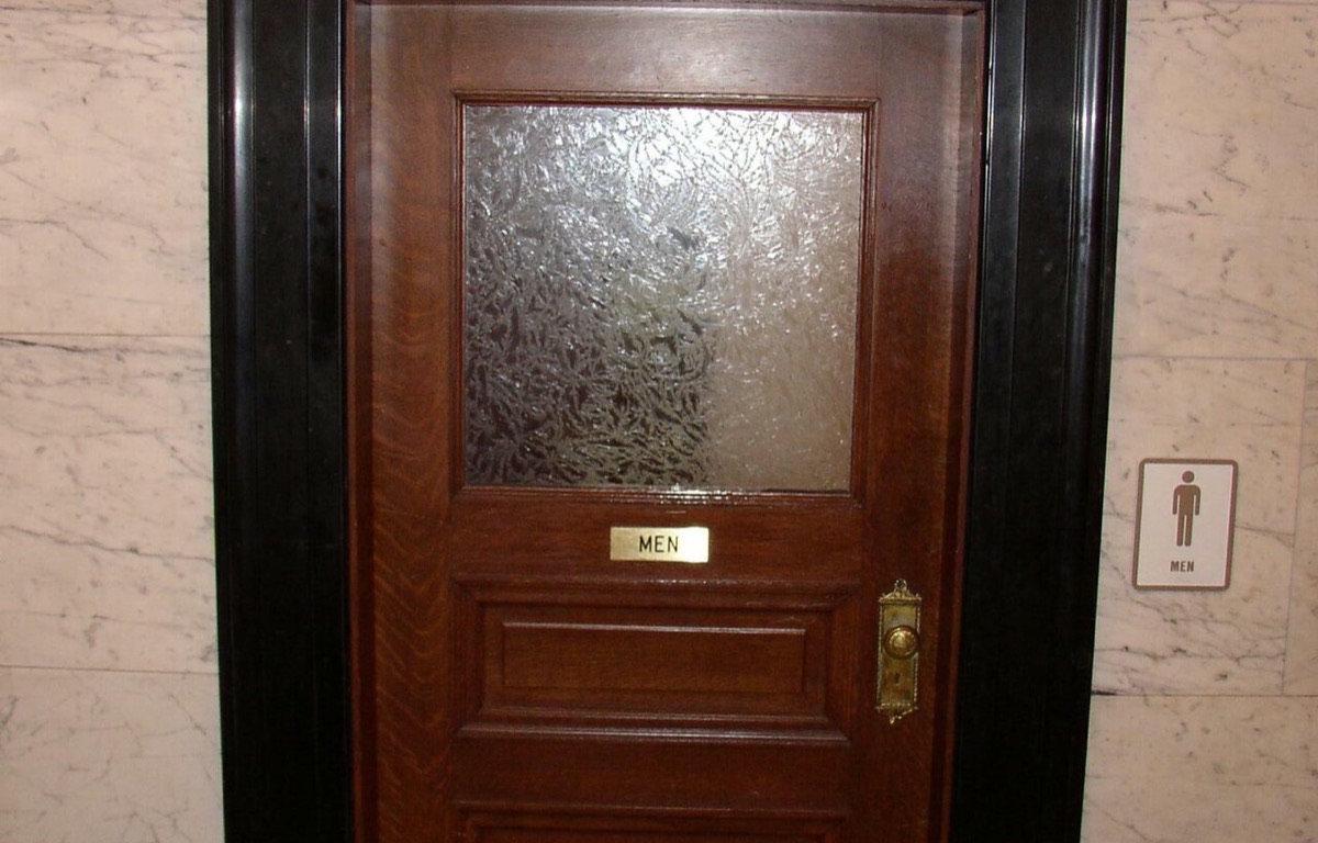 Painted bathroom door viewed from inside the room