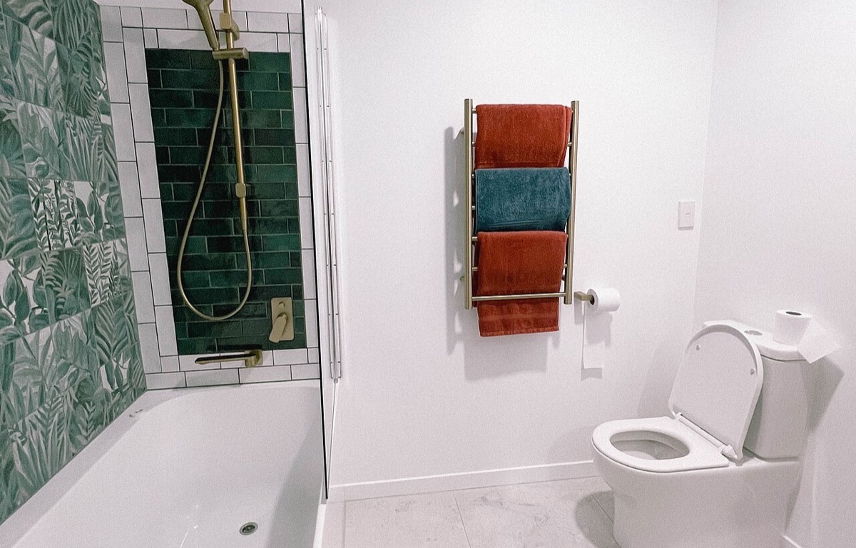 Compact modern bathroom with a glass shower enclosure
