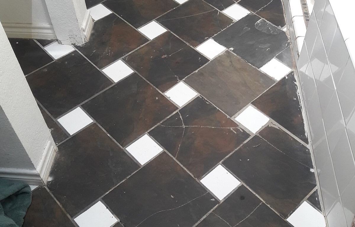 Cracked floor tile in a bathroom