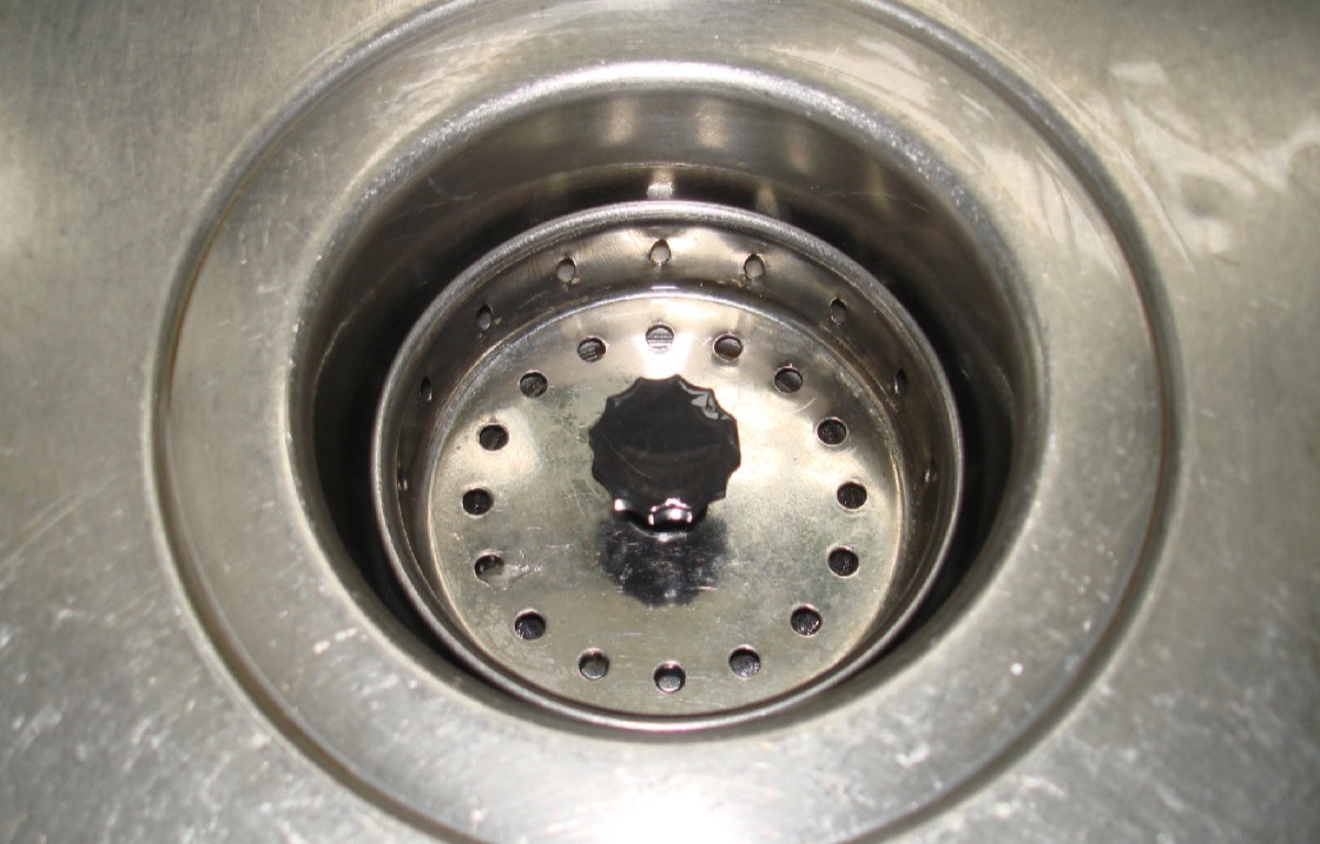 Stainless-steel drain opening in a kitchen sink